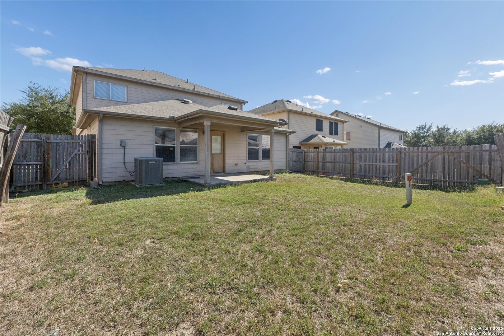 9219 Hanover Cove Converse, TX 78109 - Photo 41 of 46 a view of a house with a yard and a large tree