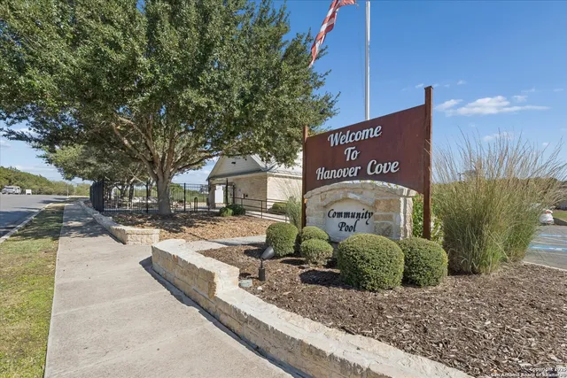 a view of a sign board with yard