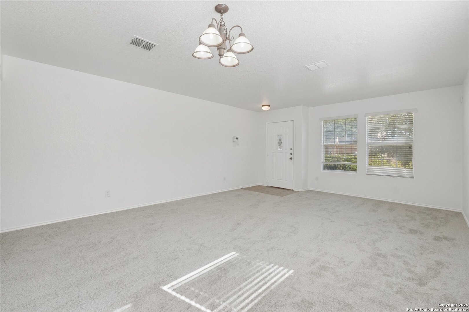9219 Hanover Cove Converse, TX 78109 - Photo 7 of 46 an empty room with a window