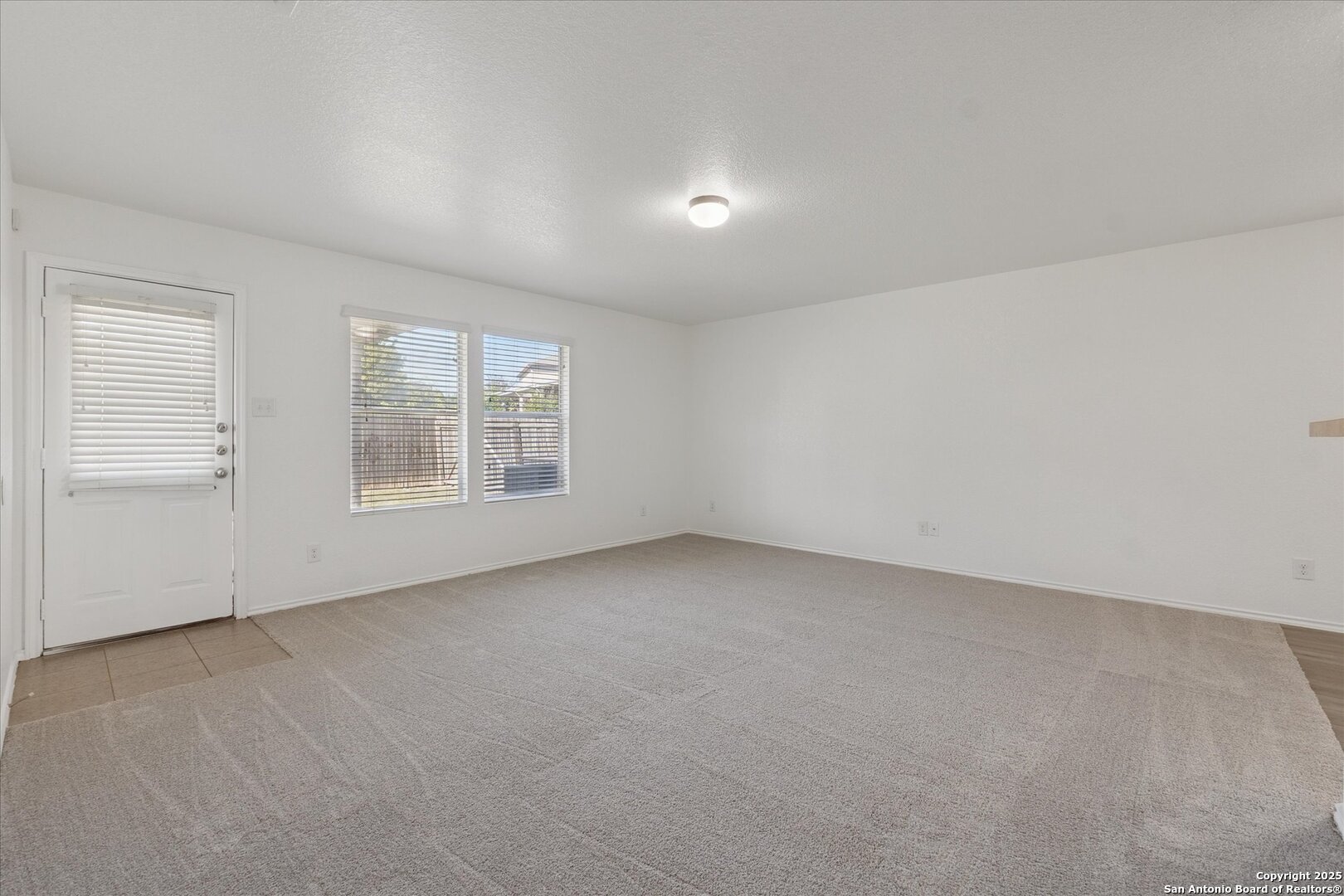 9219 Hanover Cove Converse, TX 78109 - Photo 8 of 46 an empty room with windows