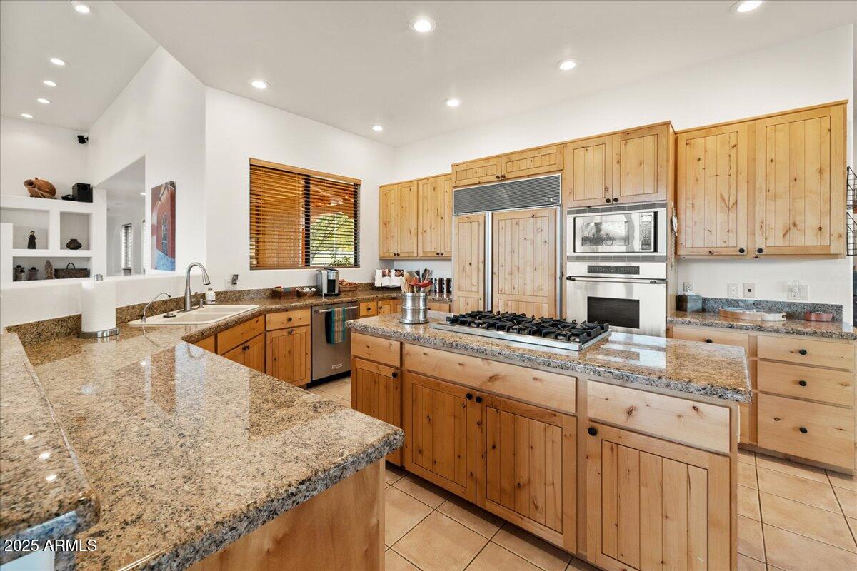 1575 Rio Verde Lane Camp Verde, AZ 86322 - Photo 16 of 57 a large kitchen with stainless steel appliances granite countertop a sink and cabinets
