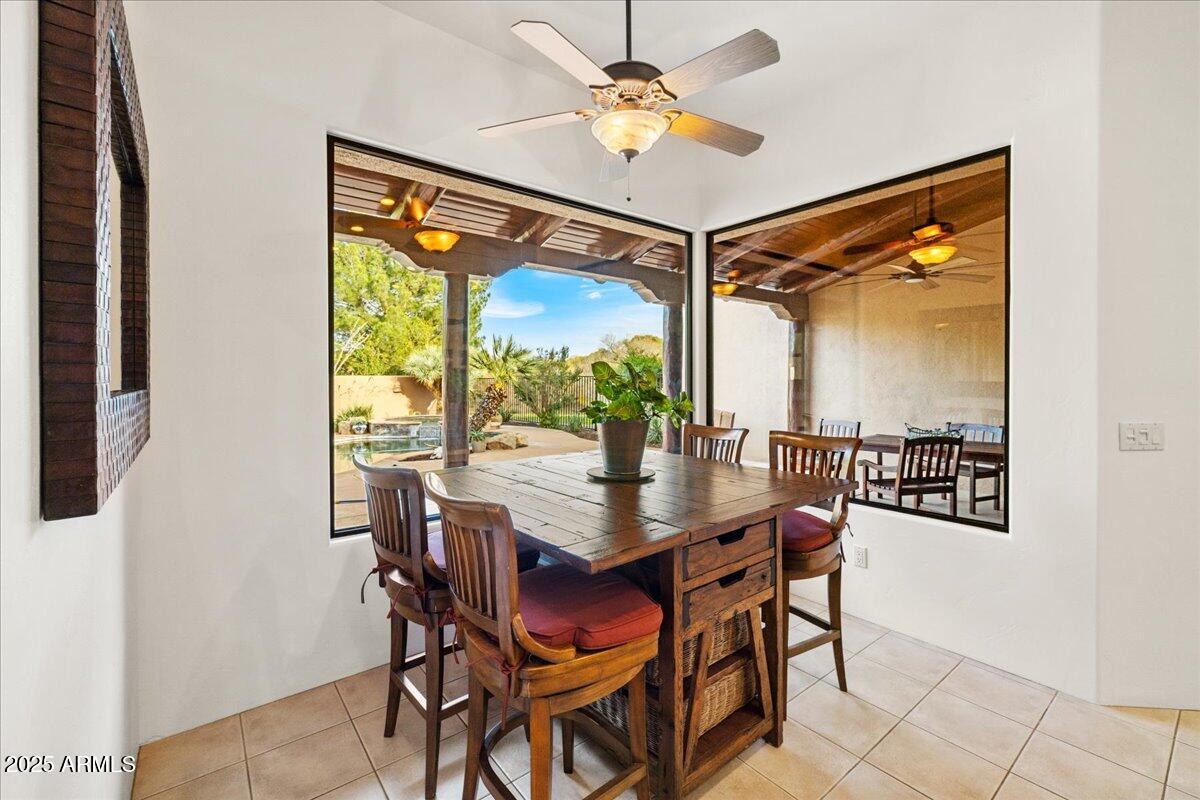 1575 Rio Verde Lane Camp Verde, AZ 86322 - Photo 18 of 57 a dining room with furniture a chandelier and wooden floor