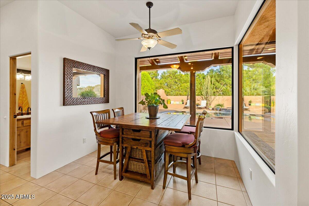 1575 Rio Verde Lane Camp Verde, AZ 86322 - Photo 19 of 57 a dining room with furniture a chandelier and wooden floor