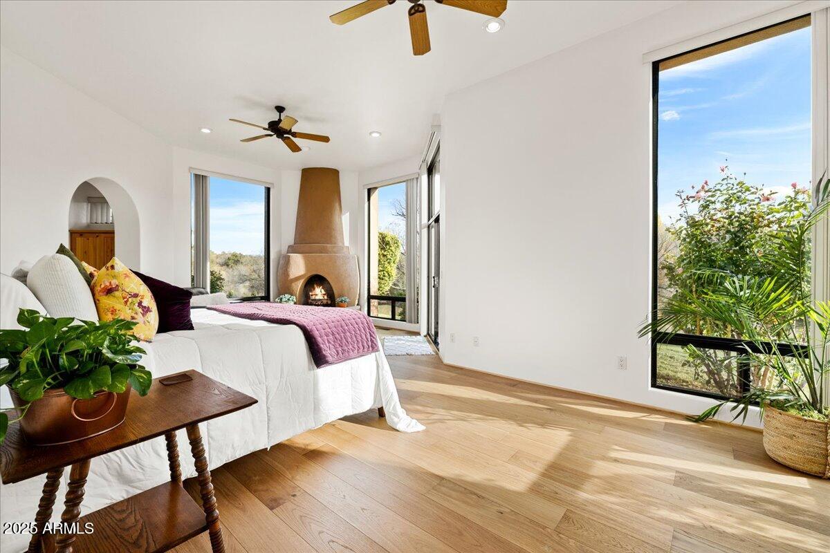 1575 Rio Verde Lane Camp Verde, AZ 86322 - Photo 22 of 57 a bedroom with a bed and a chandelier