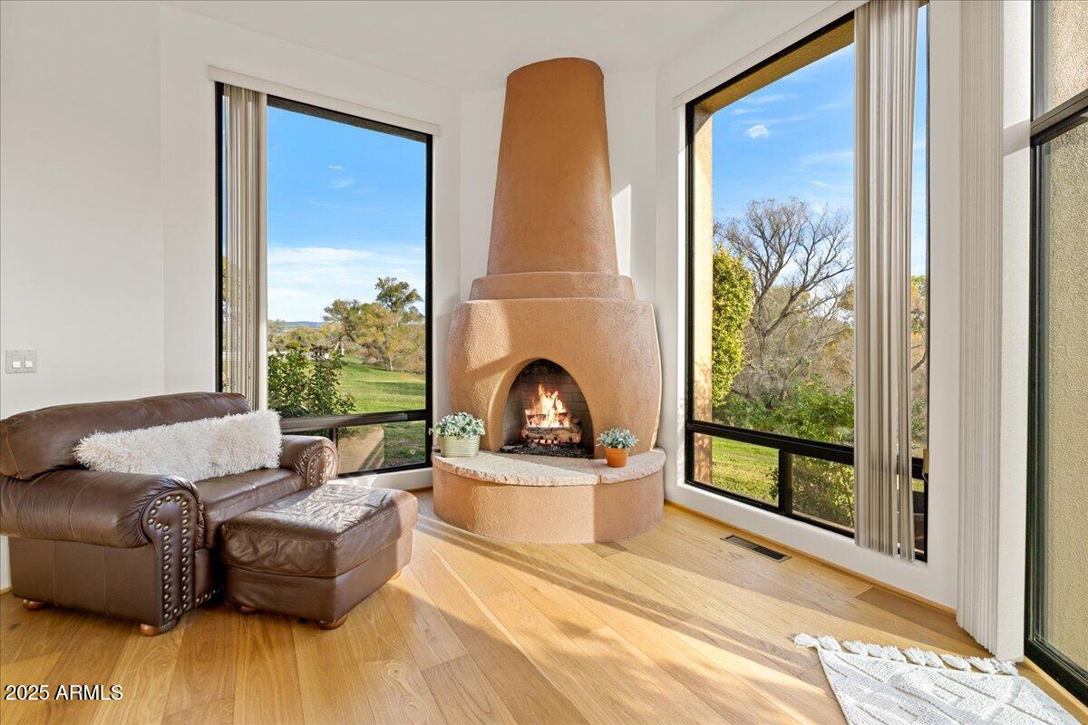 1575 Rio Verde Lane Camp Verde, AZ 86322 - Photo 24 of 57 a living room with furniture a floor to ceiling window and a flat screen tv