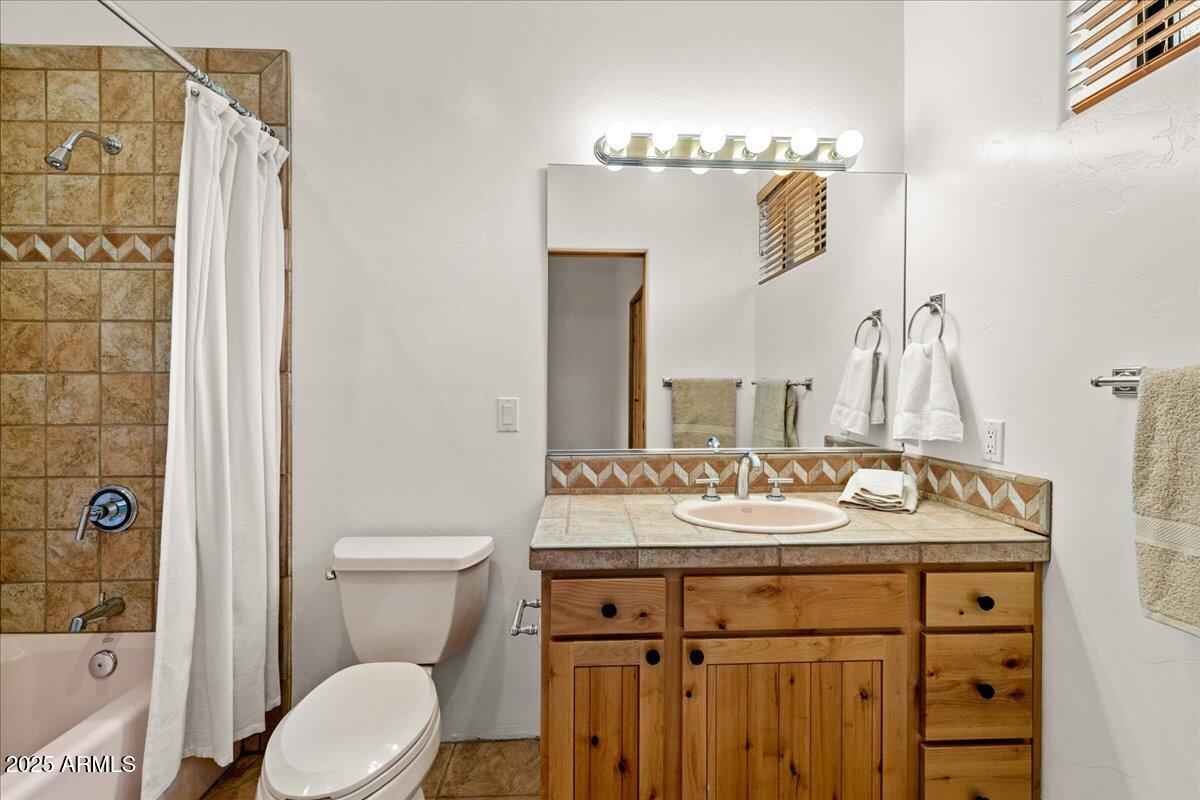 1575 Rio Verde Lane Camp Verde, AZ 86322 - Photo 31 of 57 a bathroom with a sink vanity mirror and toilet