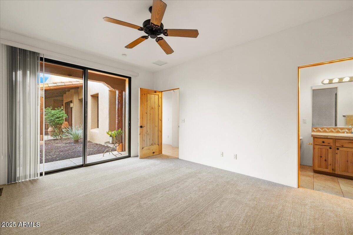1575 Rio Verde Lane Camp Verde, AZ 86322 - Photo 32 of 57 a view of a livingroom with a ceiling fan and window