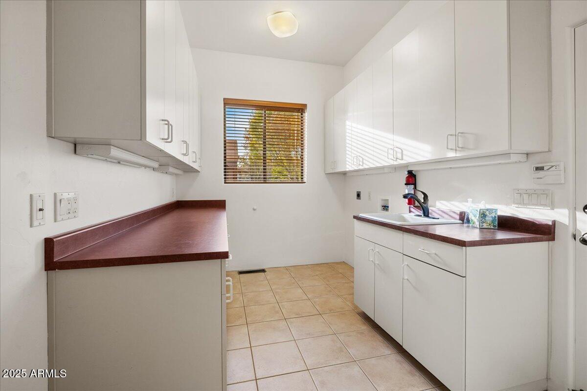 1575 Rio Verde Lane Camp Verde, AZ 86322 - Photo 35 of 57 a kitchen with stainless steel appliances granite countertop a sink and a refrigerator