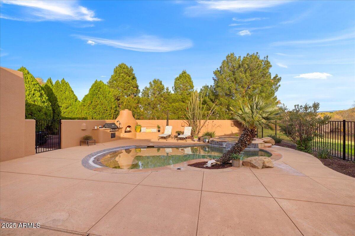 1575 Rio Verde Lane Camp Verde, AZ 86322 - Photo 40 of 57 a view of a swimming pool with an outdoor seating