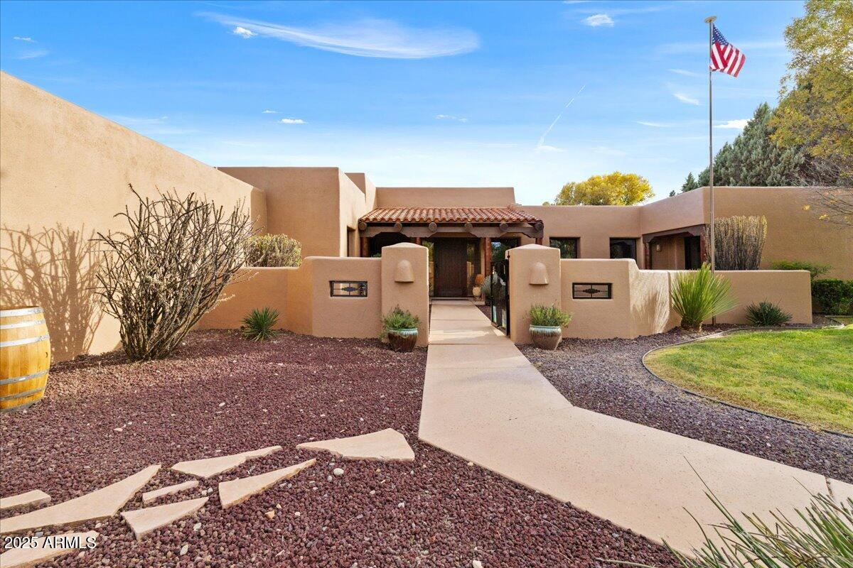 1575 Rio Verde Lane Camp Verde, AZ 86322 - Photo 4 of 57 a front view of a house with garden and parking