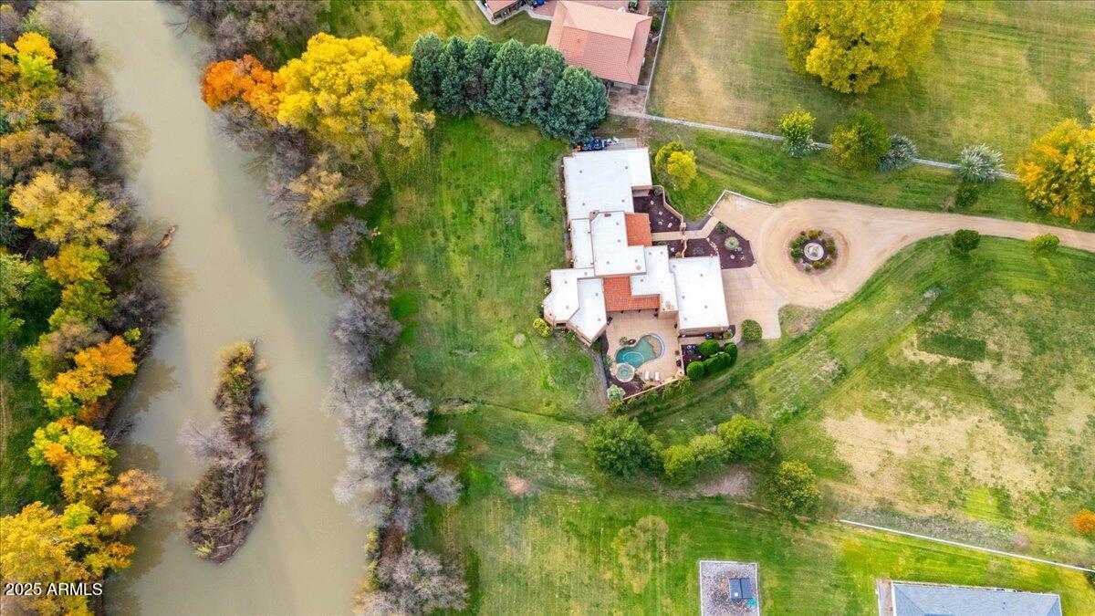 1575 Rio Verde Lane Camp Verde, AZ 86322 - Photo 50 of 57 a view of a house with a yard and a garden