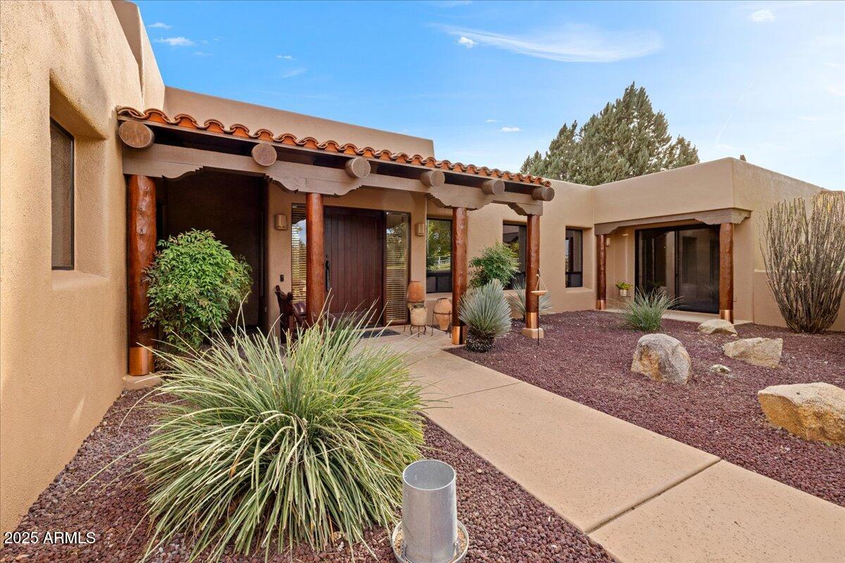 1575 Rio Verde Lane Camp Verde, AZ 86322 - Photo 6 of 57 a view of a house with potted plants in front of door
