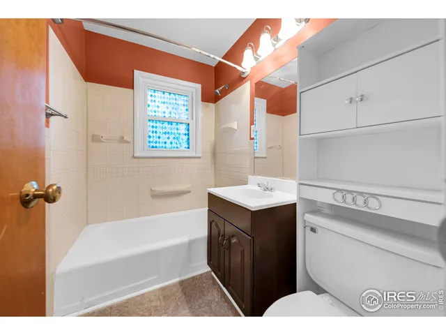 a bathroom with a bathtub a sink and a shower
