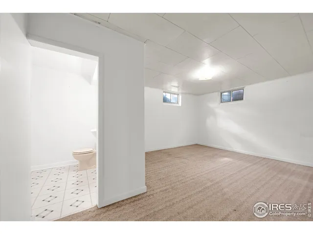 an empty room with wooden floor