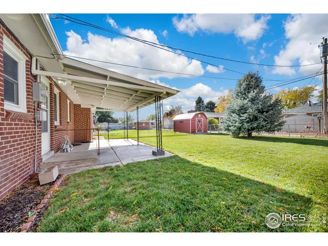 a view of a backyard with a patio