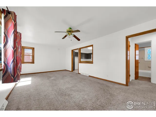 a view of livingroom with hardwood floor and a ceiling fan