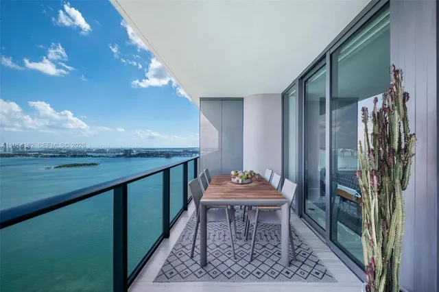 a bathroom with a shower a toilet and sink