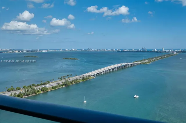 a bedroom with a bed and a desk