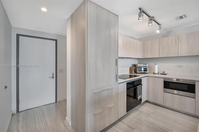 a view of storage and utility room with washer and dryer