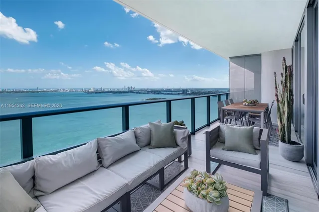 a front view of a building with a garden