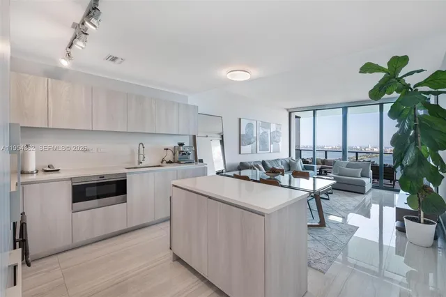 a view of a patio with a table and chairs under an umbrella