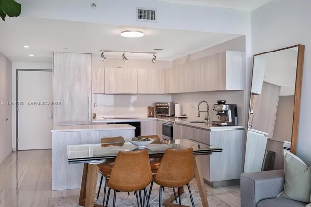 a balcony with furniture and a view of bedroom
