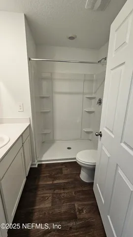 a bathroom with a sink and a shower
