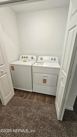 a utility room with dryer and washer