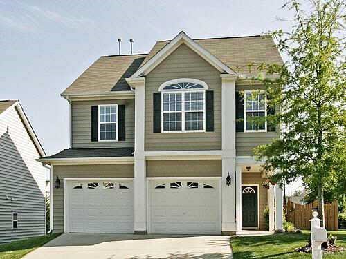 8345 Tie Stone Way Raleigh, NC 27613 - Photo 1 of 12 a front view of a house with a yard