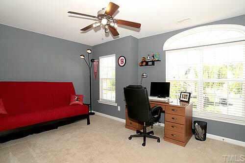 8345 Tie Stone Way Raleigh, NC 27613 - Photo 11 of 12 a view of a workspace with furniture and a window
