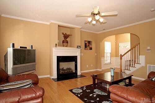 8345 Tie Stone Way Raleigh, NC 27613 - Photo 2 of 12 a living room with furniture and a fireplace