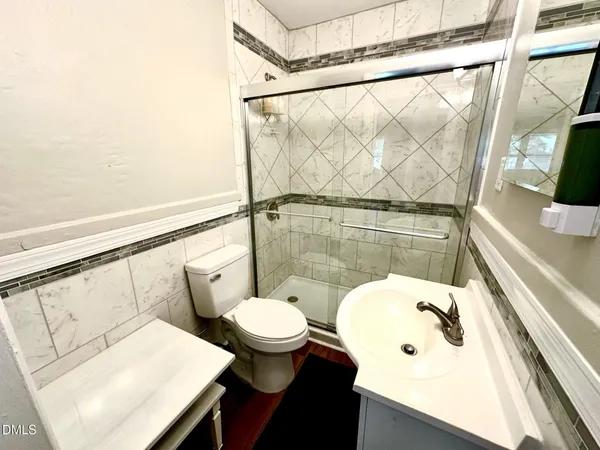 a bathroom with a sink and a shower