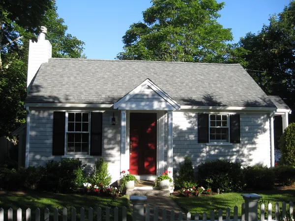 a view of house with yard and green space