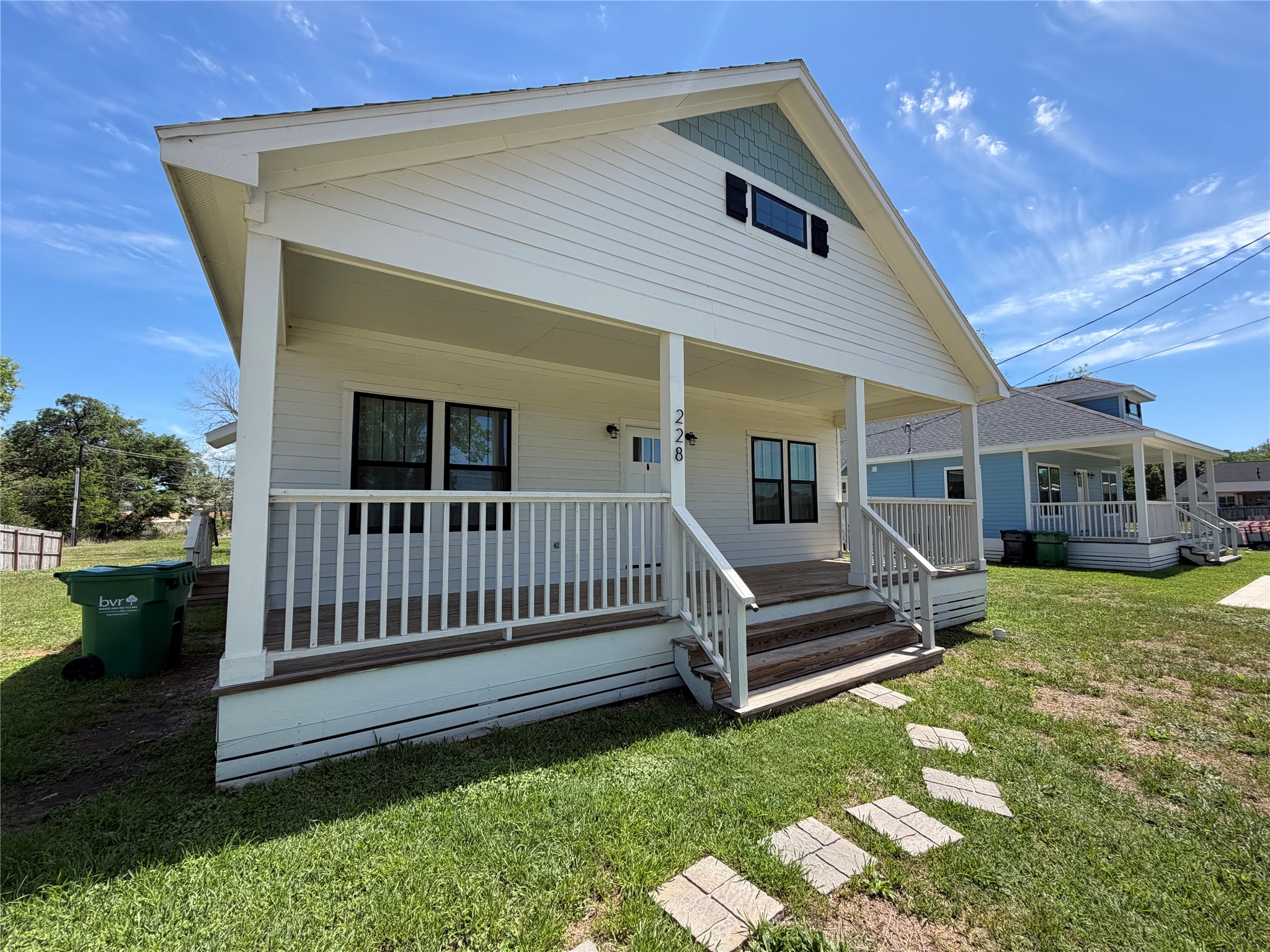 228 North Dixie Street Brenham, TX 77833 - Photo 10 of 10 a view of a porch with furniture and garden