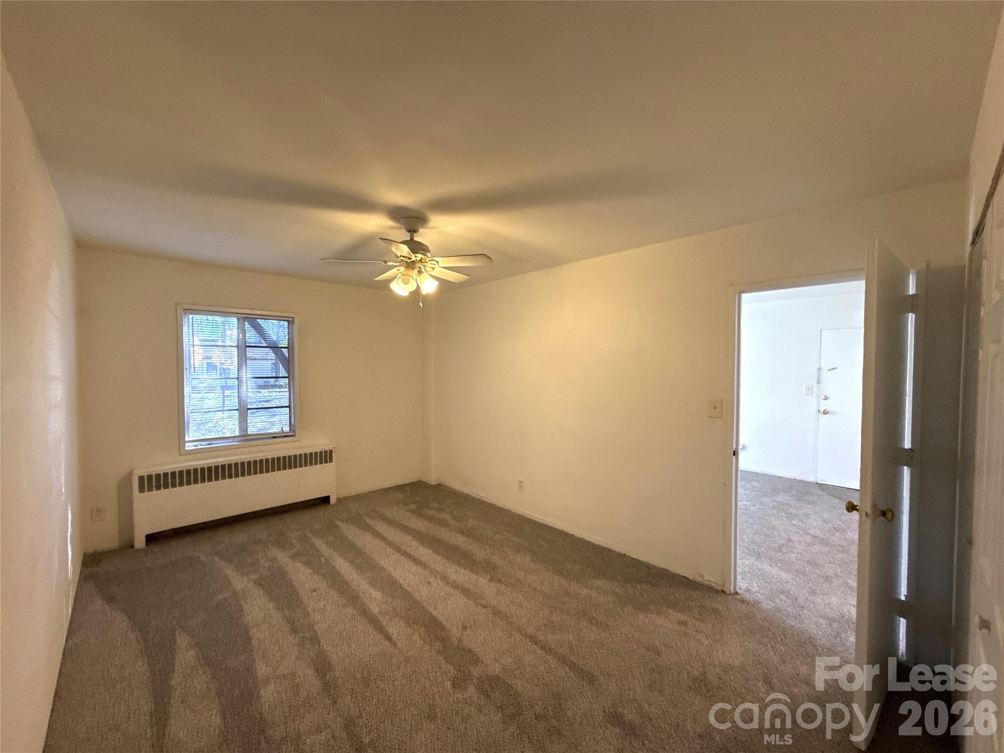2126 East 7th Street, Unit 103 Charlotte, NC 28204 - Photo 6 of 8 a view of an empty room with a window