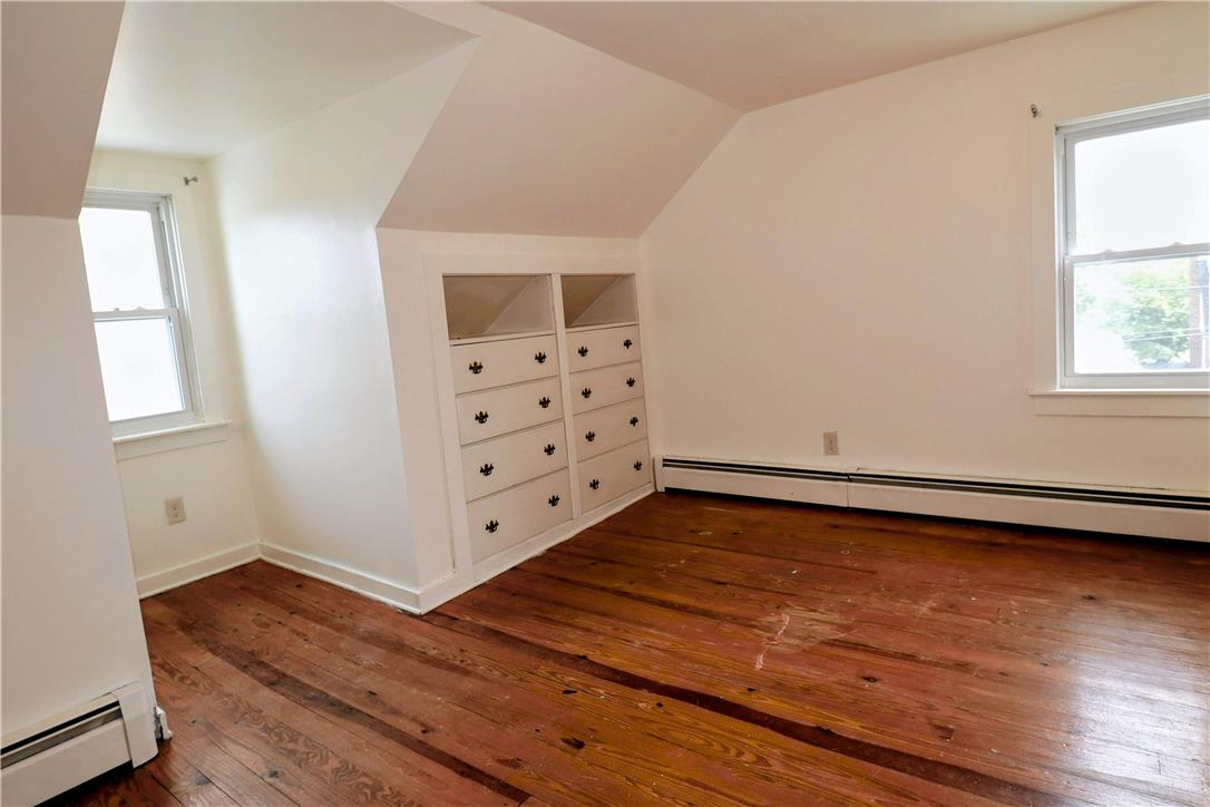 172 Harrison Street Emmaus, PA 18049 - Photo 14 of 30 Hardwood floors and built-in drawers offer practical elegance to this charming bedroom space.