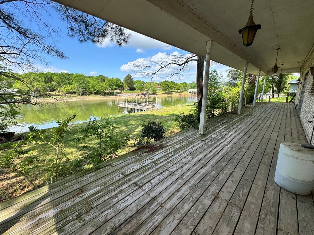 3909 Smothers Road Caney City, TX 75148 - Photo 30 of 35 a view of a balcony with wooden floor