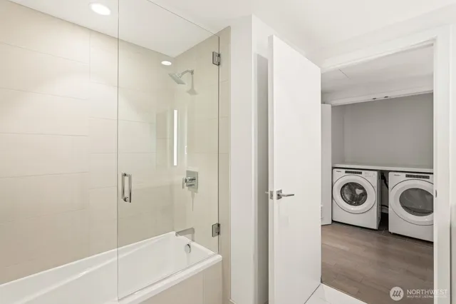 a bathroom with a bathtub and a shower