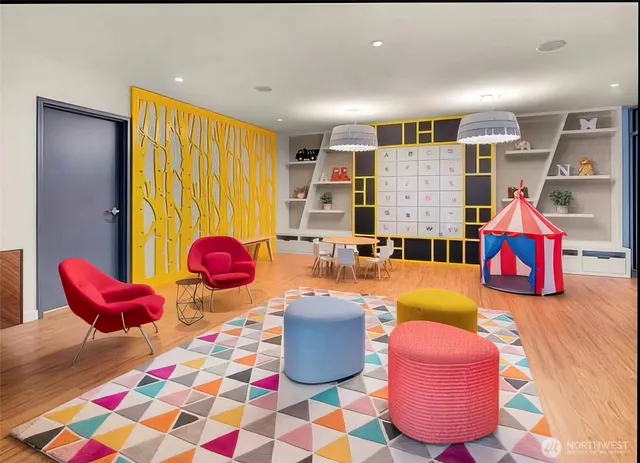 a living room with lots of furniture and gym equipment