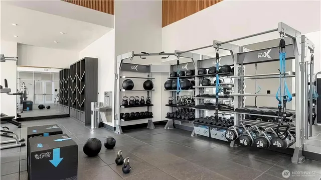 a swimming pool with table and chairs