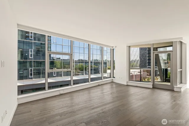 a view of a garden with wooden floor and windows