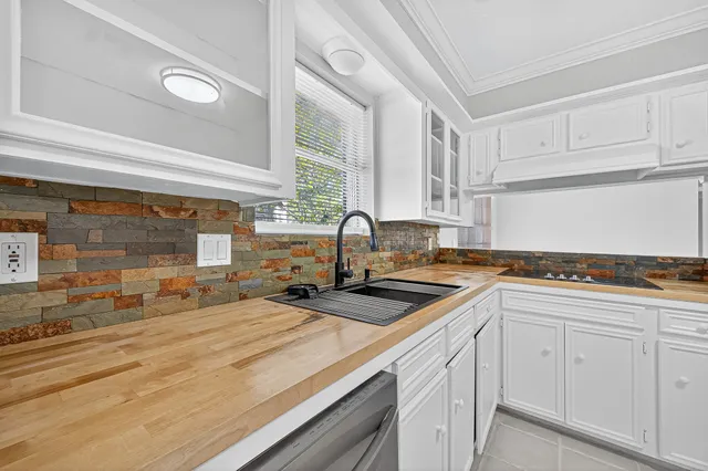 a kitchen with a sink and cabinets