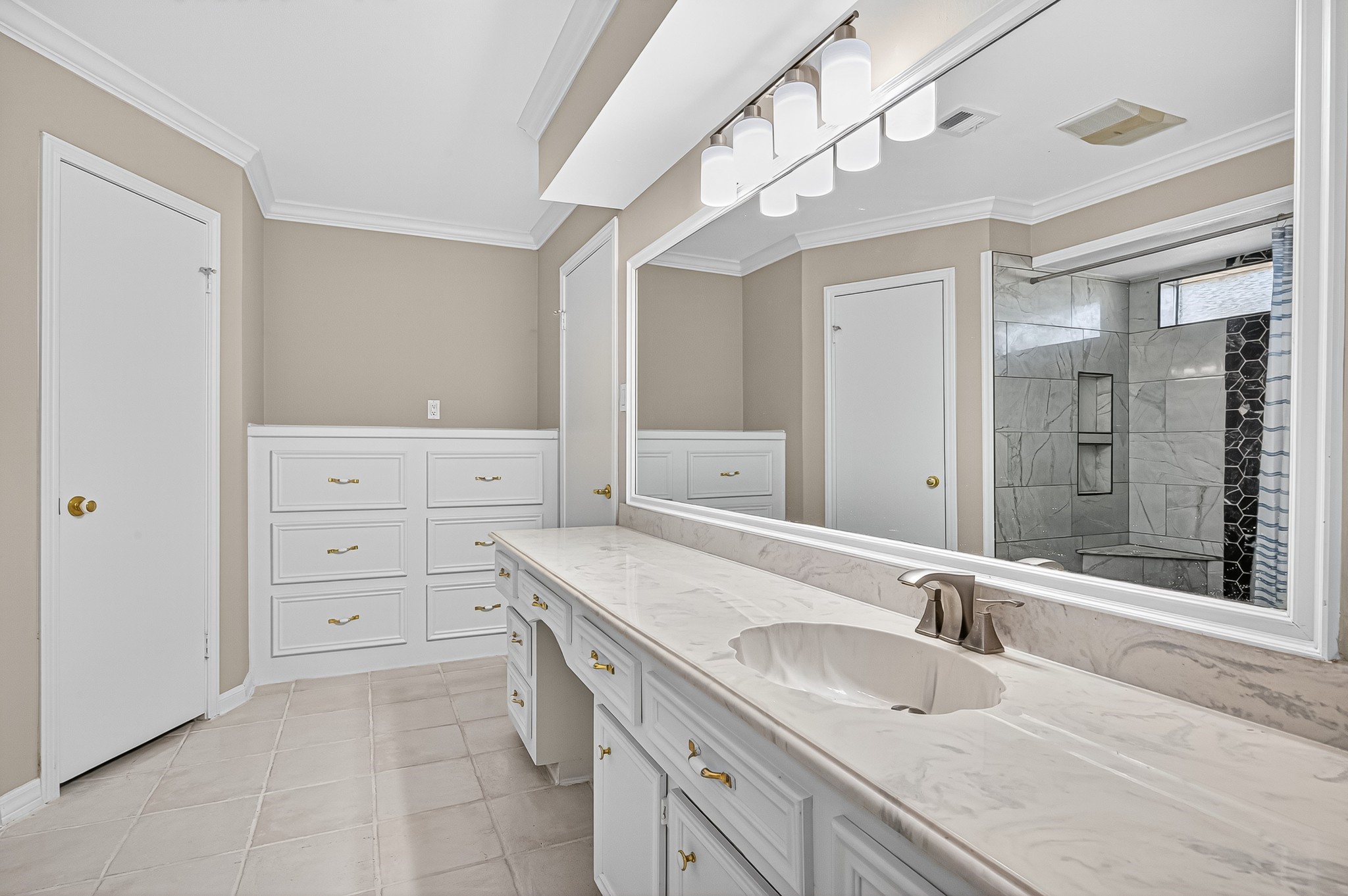 13903 Chevy Chase Drive Houston, TX 77077 - Photo 34 of 48 a bathroom with a granite countertop sink mirror and double