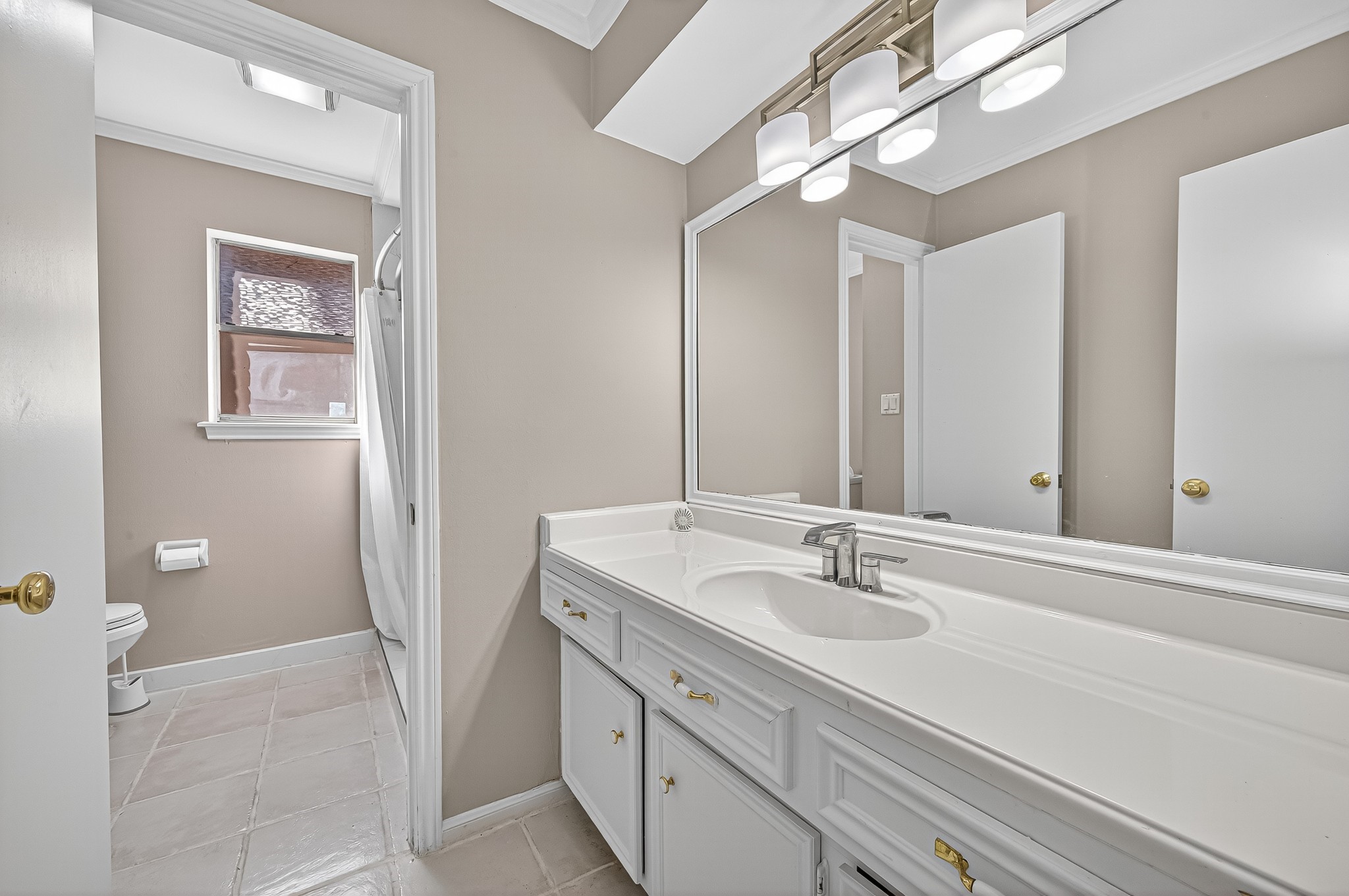13903 Chevy Chase Drive Houston, TX 77077 - Photo 35 of 48 a bathroom with a sink and a mirror
