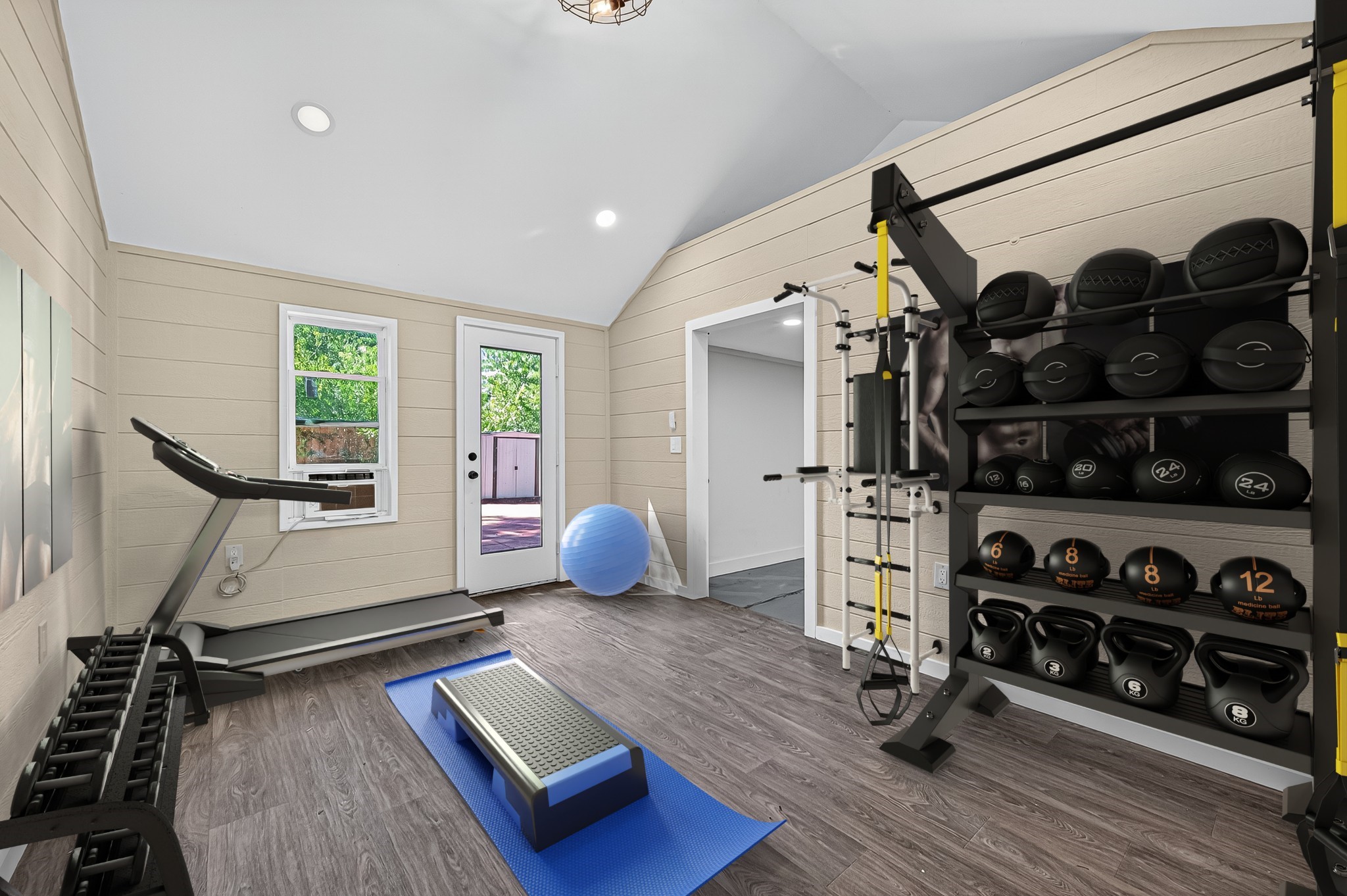 13903 Chevy Chase Drive Houston, TX 77077 - Photo 39 of 48 a room with gym equipment and a large window