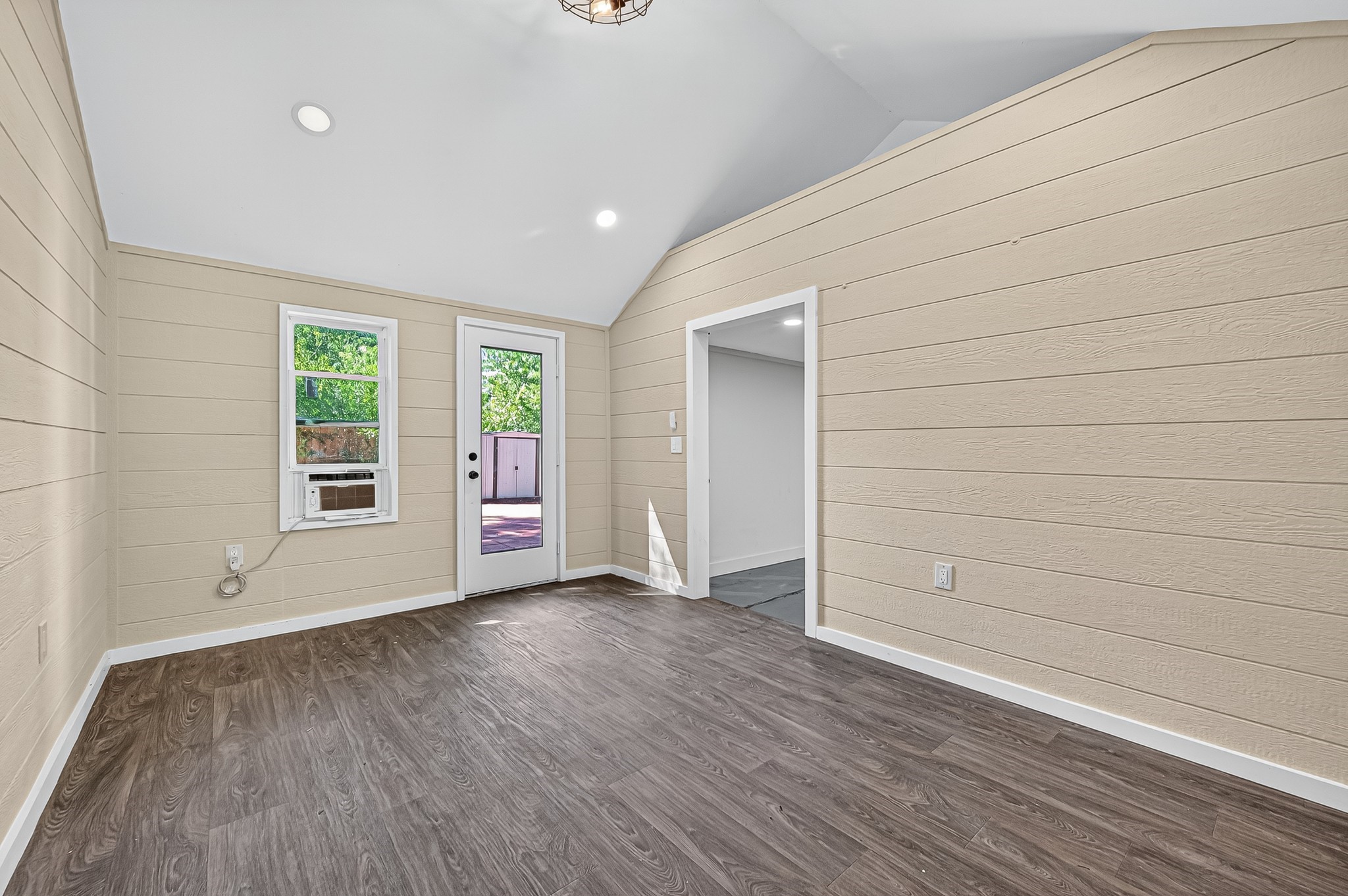13903 Chevy Chase Drive Houston, TX 77077 - Photo 40 of 48 an empty room with wooden floor and windows
