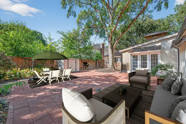 a front view of a house with a yard and a garage
