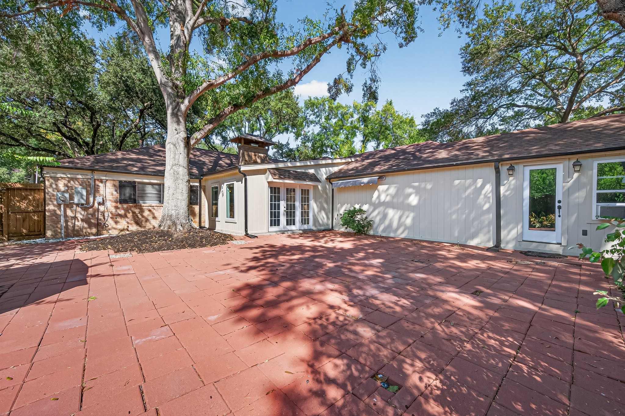 13903 Chevy Chase Drive Houston, TX 77077 - Photo 44 of 48 a front view of a house with a yard and a garage