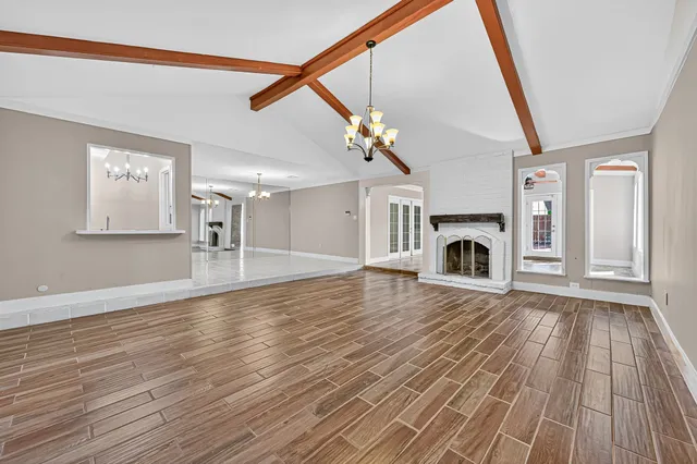 a view of livingroom with furniture fireplace and wooden floor