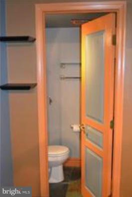 11607 Stoneview Square, Unit 2B Reston, VA 20191 - Photo 11 of 20 a white toilet sitting next to a shower